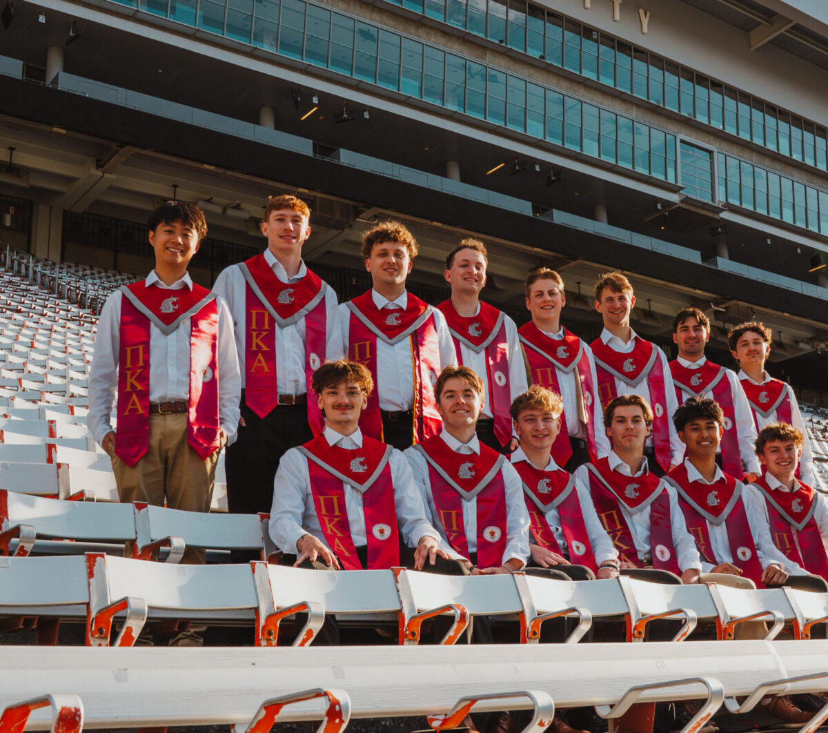 Pi Kappa Alpha graduates in caps and gowns